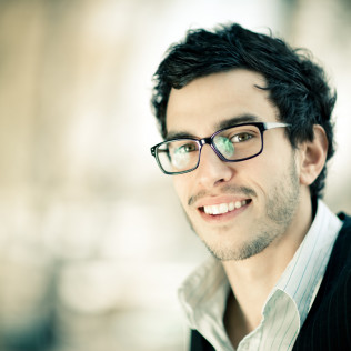 smiling man with glasses